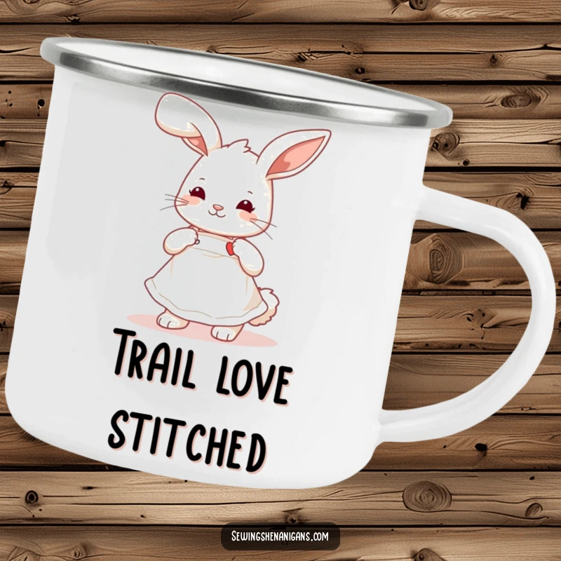 Funny playful bunny wearing a cute apron, stitching a tiny heart, a durable and humorous camping mug.