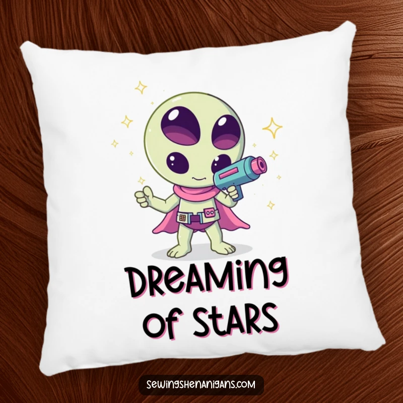 Funny kawaii alien waving a ray gun that shoots sparkles, a humorous and cuddly design on this pillow, great for comfort.