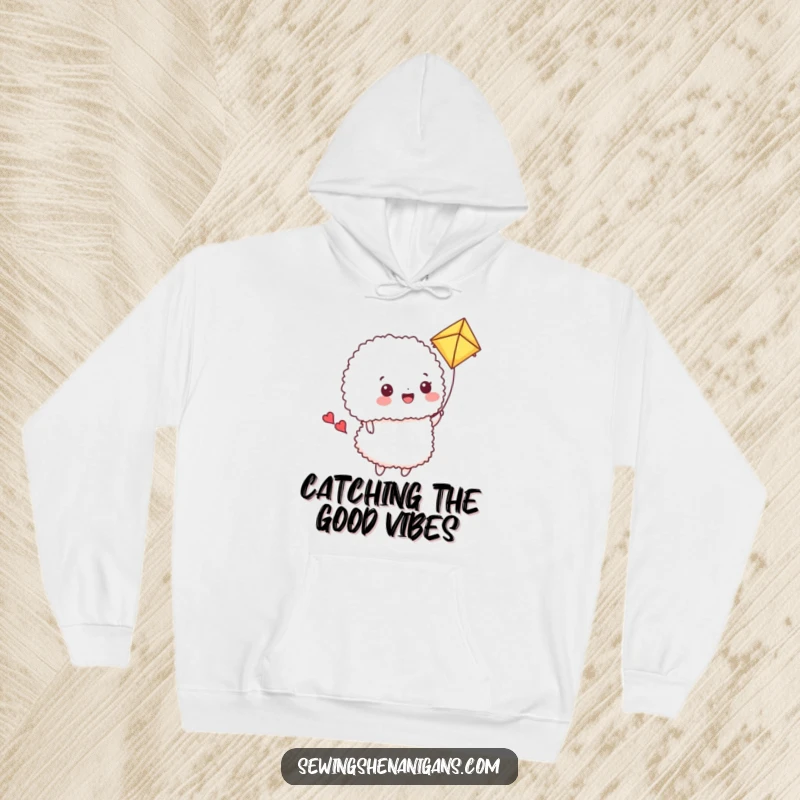 Funny Hoodie: A happy pincushion flies a fabric scrap kite, bringing cozy playful humor.