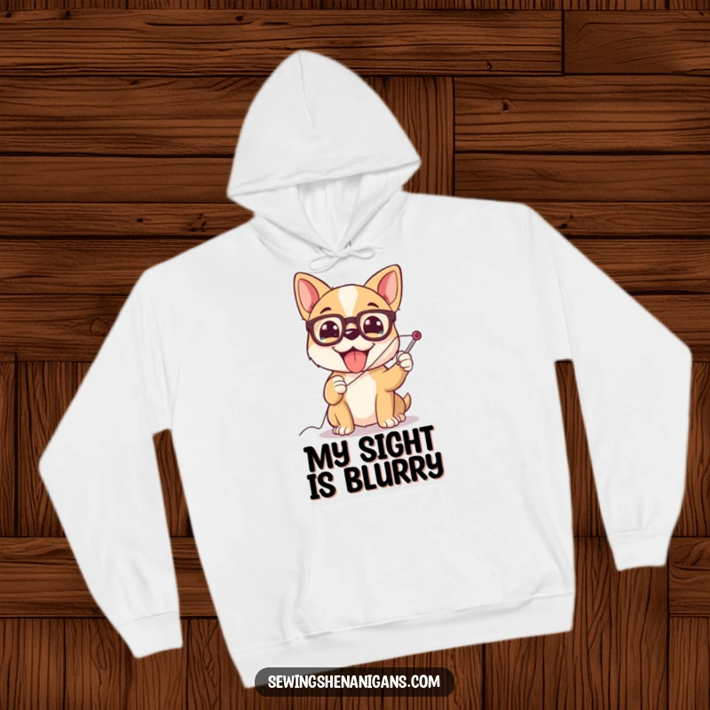 Funny dog wearing glasses, struggling with a giant needle, a comfortable and humorous hoodie for crafters.