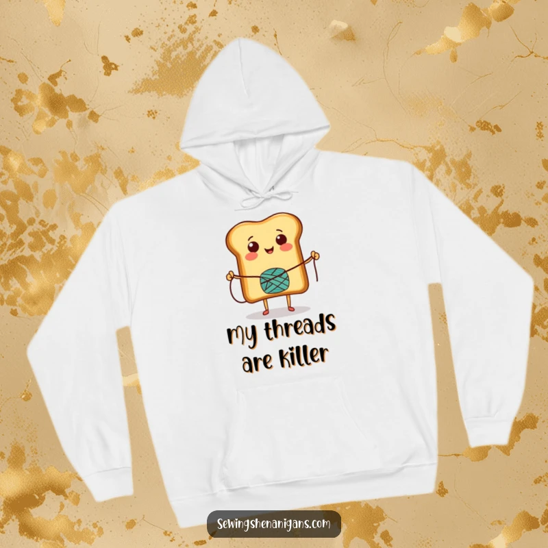 Funny Hoodie showcasing a happy toast character leaping while skipping rope with a thread spool, promoting comfort and a cheerful vibe.