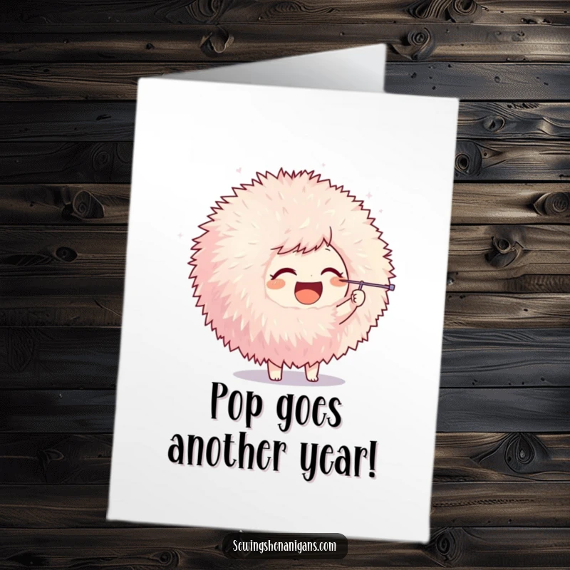 Funny Free Printable Birthday Card: Joyful character playfully poking a giant fluffy pom-pom with a needle, whimsical and cute.