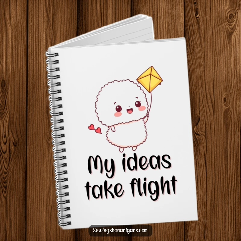 Funny Notebook: A happy pincushion flies a fabric scrap kite, inspiring funny sewing adventures.