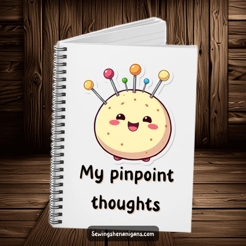 Funny notebook with a beaming pin cushion character covered in playful pins, encouraging users to write down their creative sewing ideas.