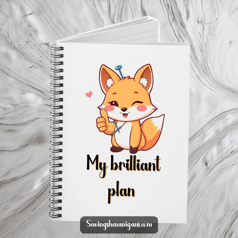 Funny happy fox wearing a sewing pin, giving a thumbs up, on a funny notebook cover, ready for crafty notes, a useful funny gift.