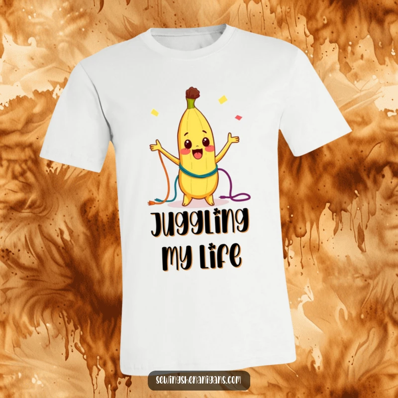 Funny T-Shirt: A curious banana character energetically juggling vibrant, colorful threads with a joyful expression.