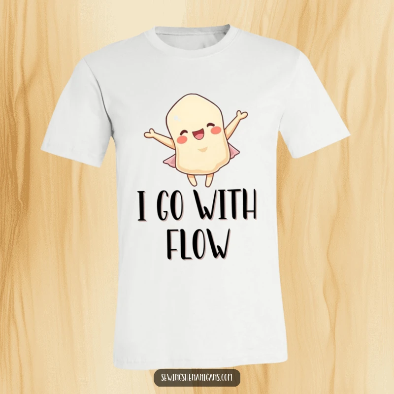 Funny t-shirt: A delighted fabric scrap character captured in a moment of pure joy, fluttering gracefully in a breeze.