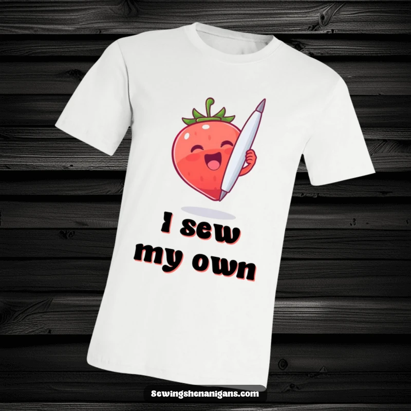 Funny Strawberry Needle T-Shirt: A joyful strawberry character holding a large needle, ideal for a funny and eccentric gift.