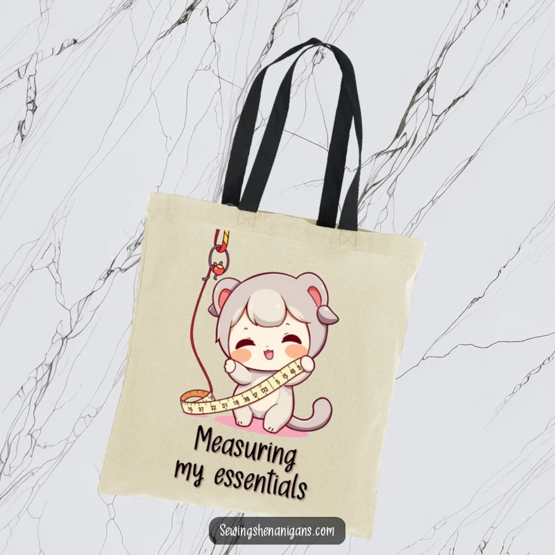 Funny tote bag featuring a character enthusiastically batting at a dangling measuring tape, great for carrying craft supplies with humor.